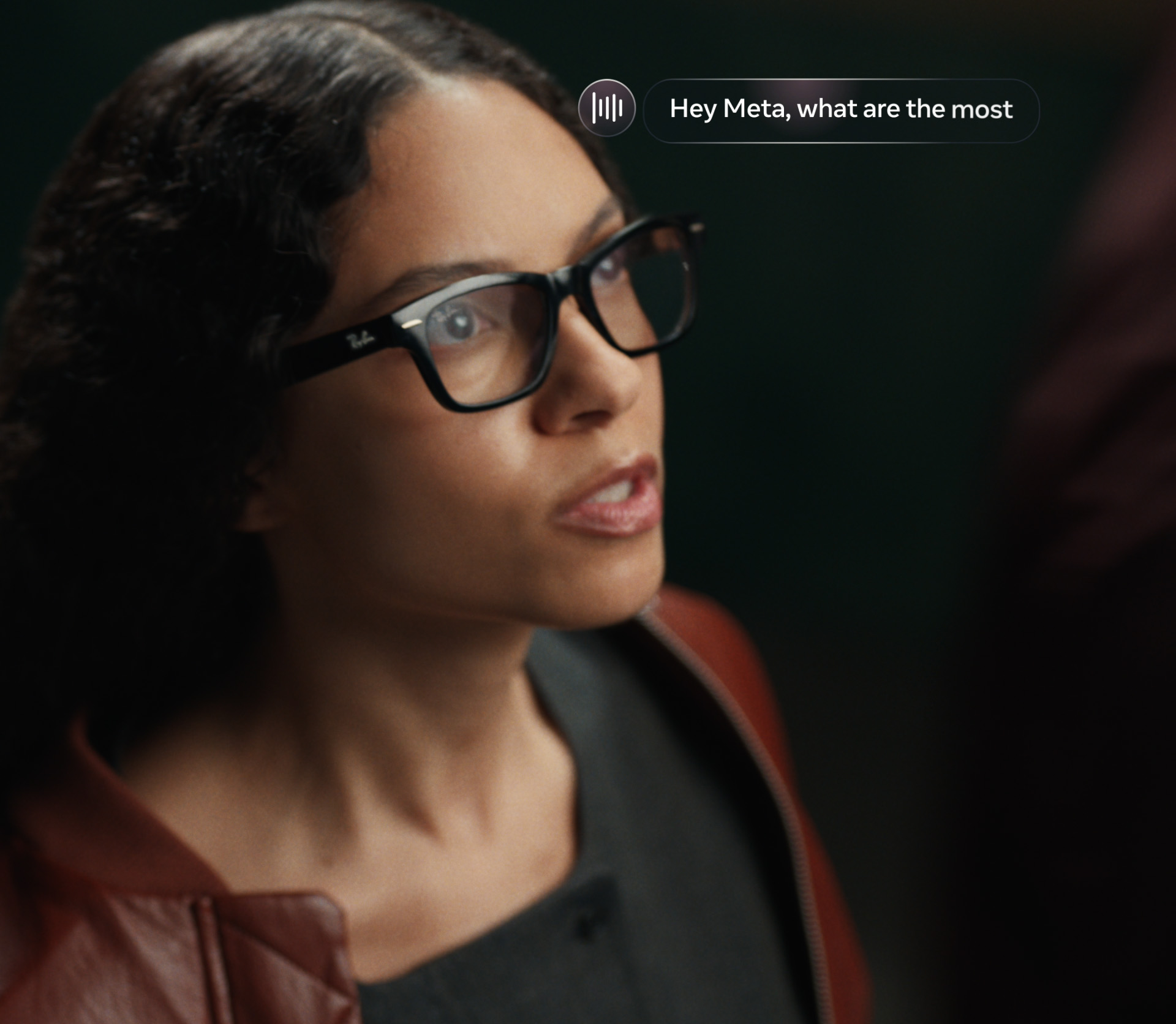 Official Meta Newsroom photo of Ray-Ban Meta Audio glasses with Hey Meta voice UI overlay
