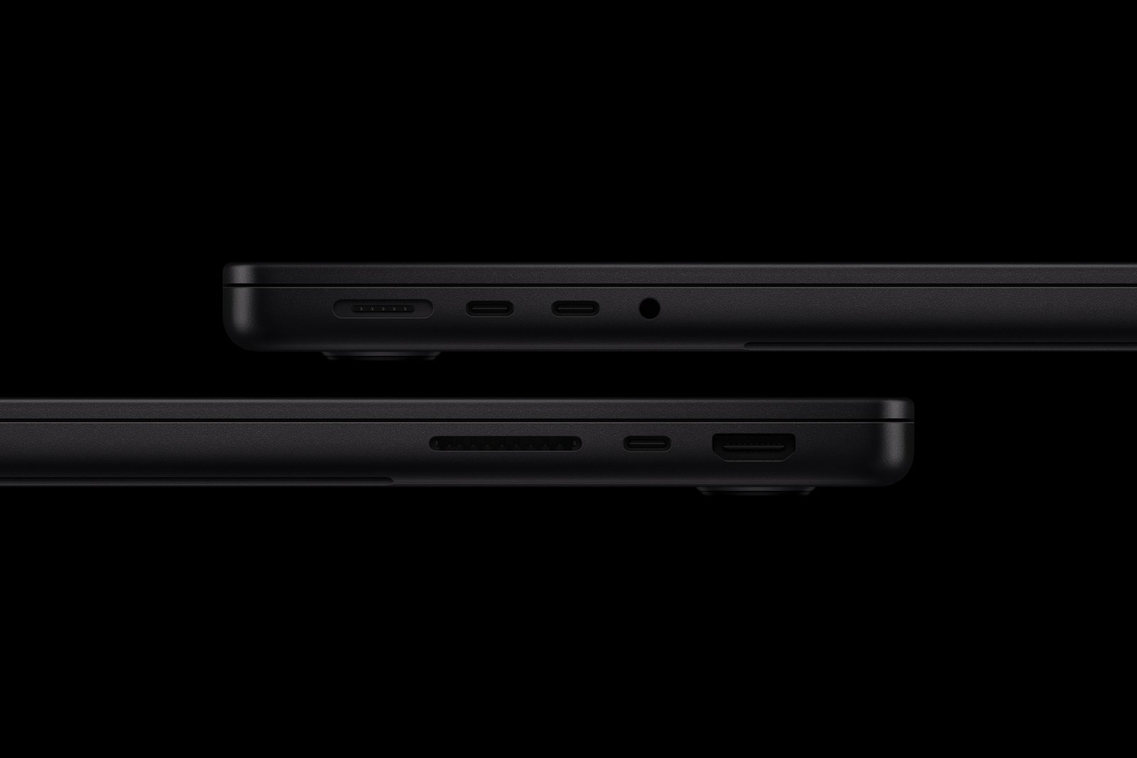 Left and right sides of the space black 14-inch MacBook Pro with M6 showing its ports