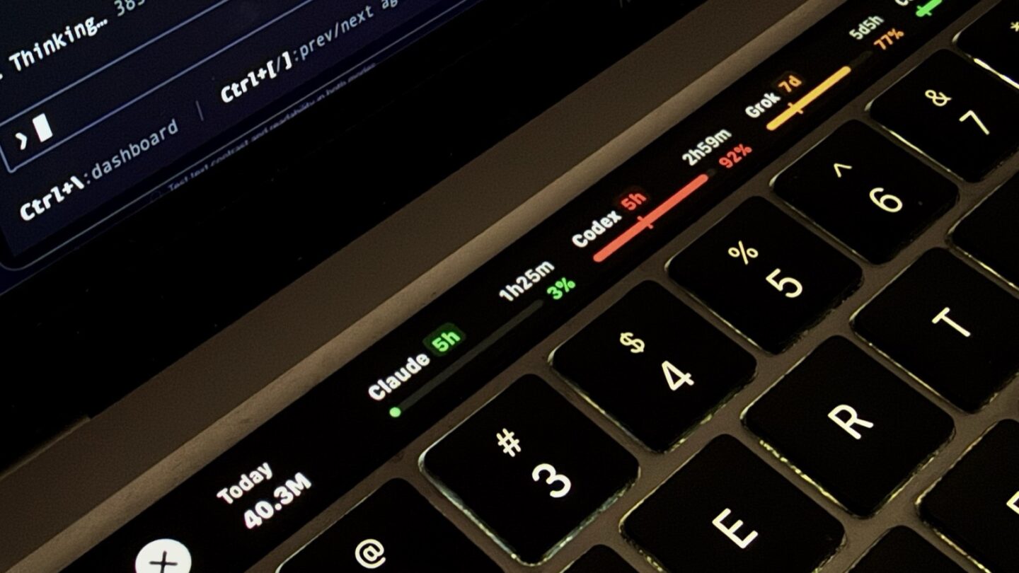 TokenBar displaying AI usage bars and reset countdowns on a MacBook Pro Touch Bar