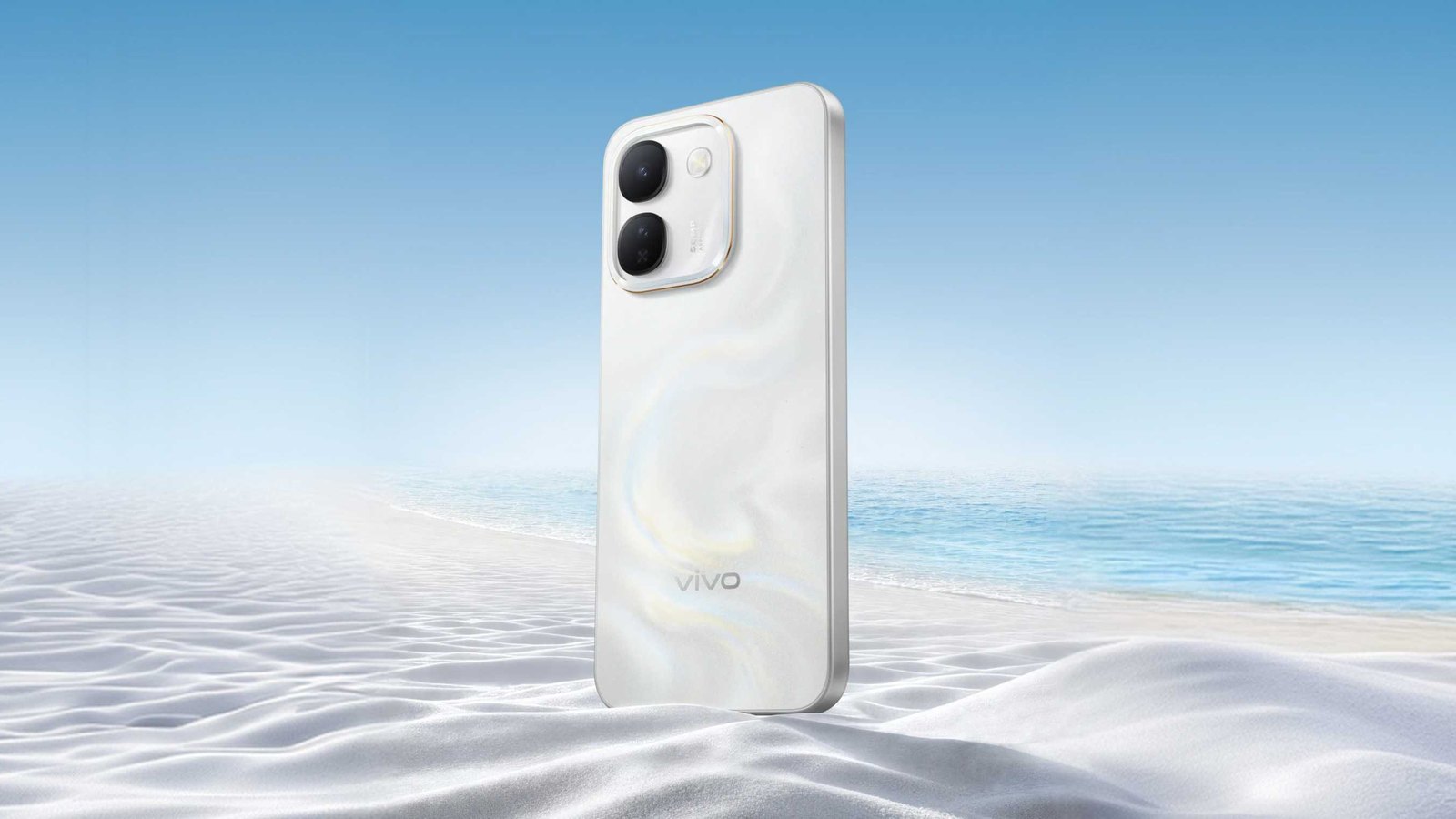 vivo S2 FE in Zen White standing on white sand with a beach and sky behind it